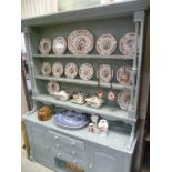 Open kitchen dresser painted in duck egg blue