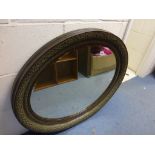 Oval wood & gilt mirror