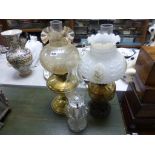 Victorian Oil Lamp with Milk Glass Shade, Amber Glass Well and Cast Iron Stand together with a Brass