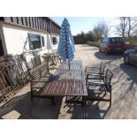 Wooden garden suite with table, two benches and parasol