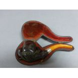 Cased Meerschaum Pipe with carved claw bowl, amber mouth piece and silver collar