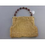 Vintage Beaded Ladies Evening Bag with Simulated Amber Bead Handle together with a Stratton Compact