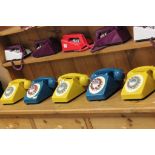 Five retro push button telephones to include 3 x Mustard and 2 x Electric blue