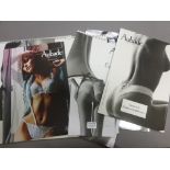 Collection of Aubade lingerie ephemera including three card shop display stands and calendars (6