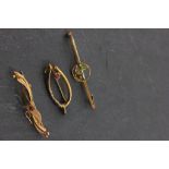 Two Edwardian 9ct Gold Brooches, each set with a small ruby together with another Yellow Metal