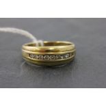 18ct Gold Ring set with a Row of Nine Small Diamonds
