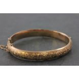 9ct Gold Hinged Bangle, one half with floral engraving, Birmingham 1888