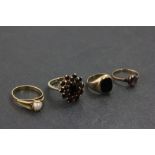 Three 9ct Gold Rings - one garnet cluster, one amethyst and one black onyx plus a Pearl set Ring