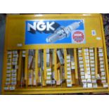 NGK Spark plug metal display unit with large quantity of boxed spark plugs