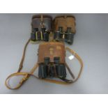 Three Leather Cased Sets of Binoculars including Dolland, Aitchison in case dated 1918 and