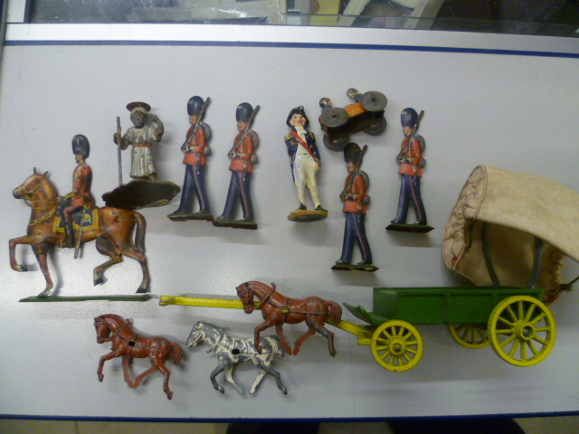 Group of vintage metal soldiers & cart including flat Guards on stands