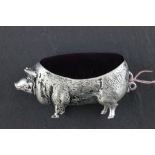 An oversized pig pin cushion stamped 800 for continental silver