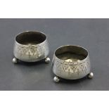 Pair of Silver Salt Cellars, each on three bun feet, London 1891