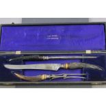 Early 20th century Three Piece Carving Set with Silver Bands and Antler Handles