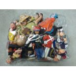 Large collection of vintage souvenir tourist dolls