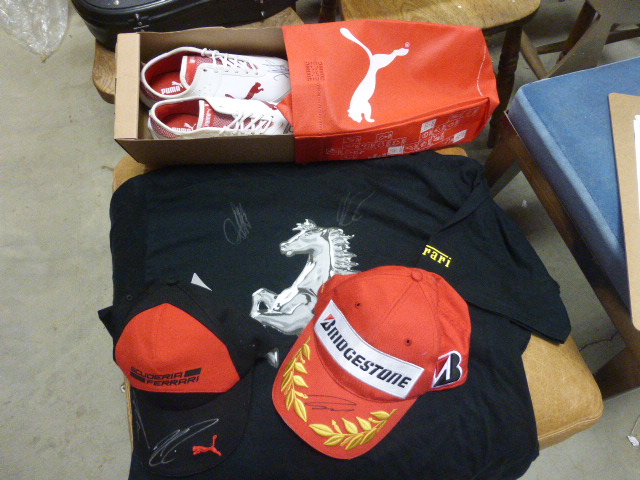 Signed Ferrari and Formula 1 Racing Merchandise including Two Caps, T-Shirt and Puma Trainers