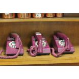 Three purple trim phones