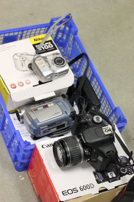 Two digital cameras to include Canon EOS 600D with lens and Nikon Coolpix 3100 plus a Canon video