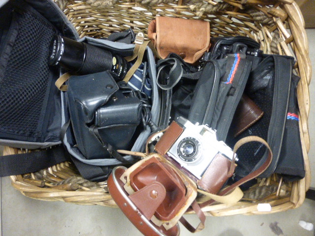 Wicker Basket containing Cameras including Praktica, Fujica, Tamron Lens and Case, Canon T80,