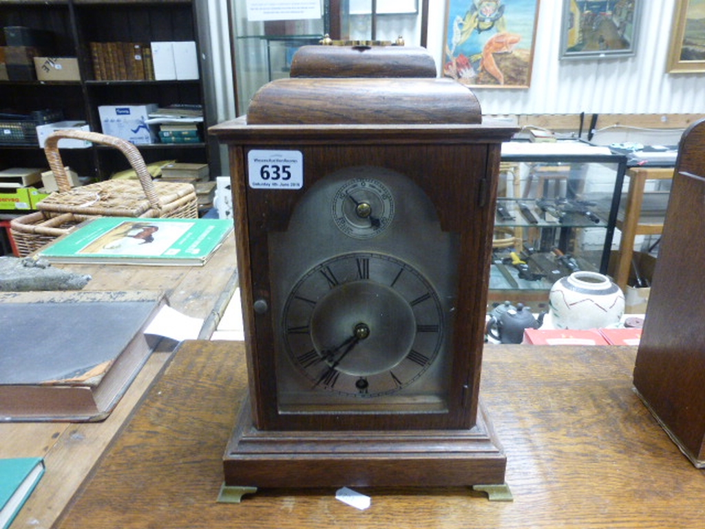 Oak Cased Bracket Clock with silvered face and fast / slow dial
