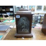 Oak Cased Bracket Clock with silvered face and fast / slow dial