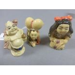 Three netsuke carvings including girl with pet, Buddha and crawling boy