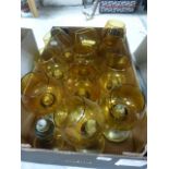 Eleven Brass and Amber Glass Candleholders, plus one base