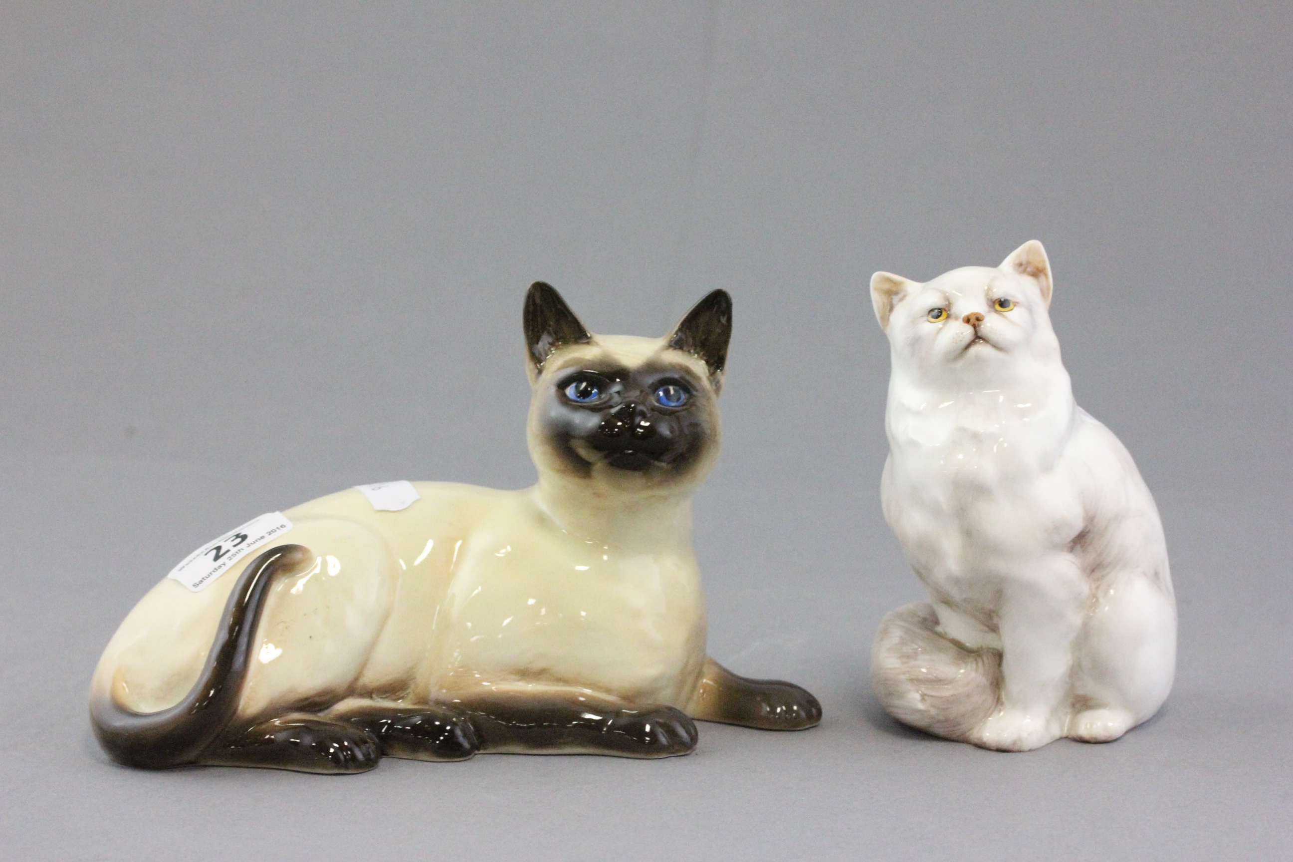 Beswick Siamese Cat model no. 1559 and a Royal Doulton Seated Cat HN2539