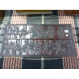 Hardwood tribal carved panel depicting combat moves