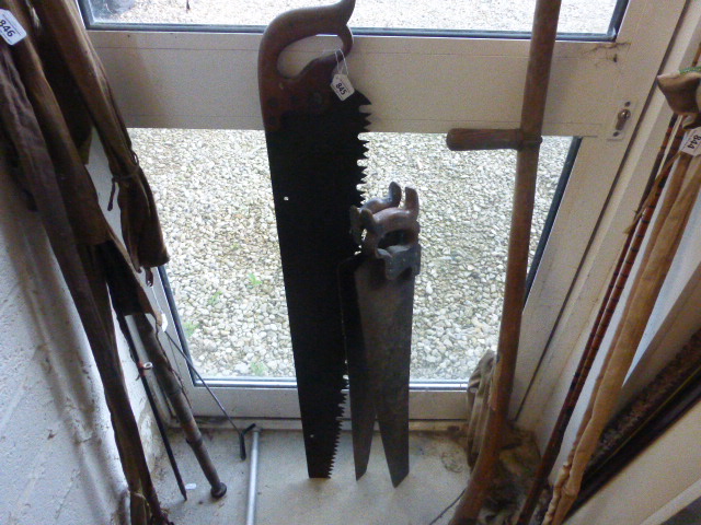 Three Antique Wooden Handled Saws plus a Sythe