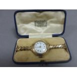 Ladies vintage yellow metal watch in Harrods case