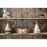 Two antique copper jugs and a copper two handled stamped Bamford