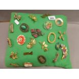 Twenty Two Costume Jewellery Brooches on Cushion