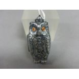 A silver plated double sovereign case in the form of an owl with glass eyes