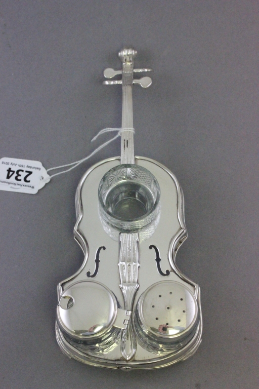 A silver plated novelty condiment set in the form of a cello