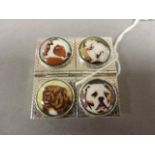A unusual silver four section pill box with pictorial enamel dog images