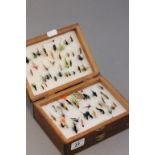 Four Trays of Fishing Flies contained in an Oak Box