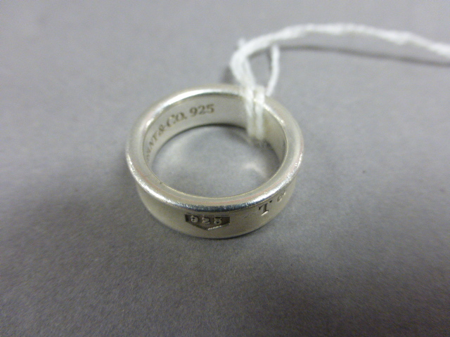 A Tiffany & Co sterling silver ring, with inscription both on the interior and exterior