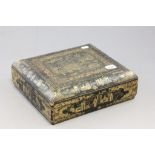 A late 19th century Chinese lacquer workbox, the lid and the sides with gold painted decoration of a
