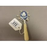 A silver and enamel set Babies Rattle with bone handle
