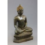 A 20th century Chinese gilt bronze Buddha, raised on a shaped plinth