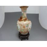 A Chinese porcelain polychrome enamelled 'dragon' bottle vase; bearing Qianlong seal mark to base,
