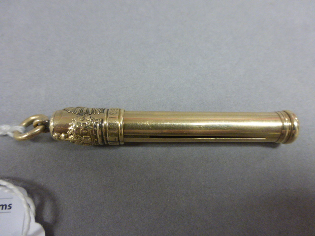 A Sampson Mordan gold plated extending pencil 'MJ Co Jubilee 1887' with sheep and sunbeam insignia