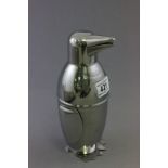 A silver plated novelty cocktail shaker in the form of a penguin