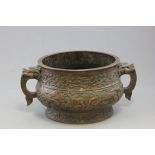 Large Chinese Bronze Twin Handled Censers with relief scenes of figures in landscape, the handles