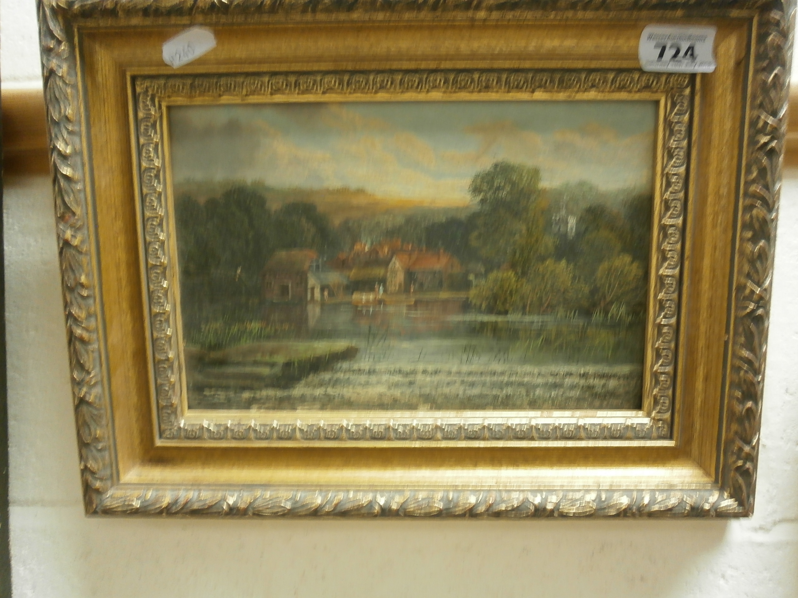 Small oil on board, rural river scene with houses and church, inscribed verso 'River Thames Sonning'