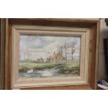 A.N. Watts; Country Cottage with River and a man standing on a bridge, signed and dated lower