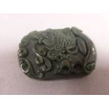 A Chinese Jade carved disc depicting koi carp