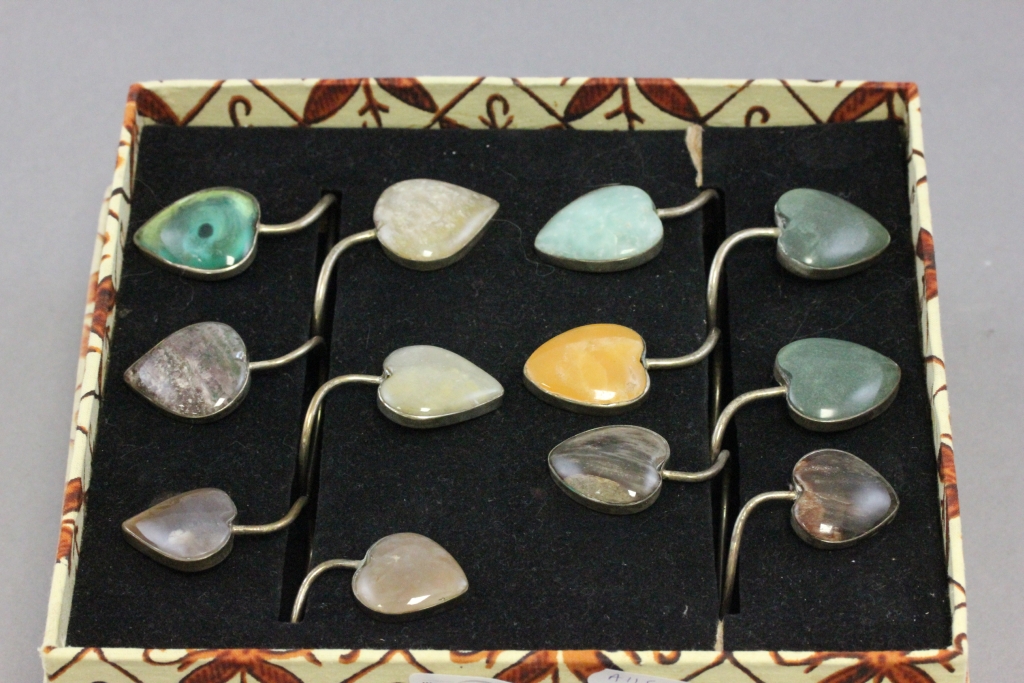 Set of Six Napkin Holders, each set with Two Heart Shaped Polished Agates