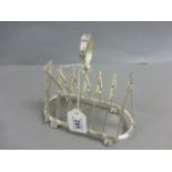 A silver plated toast rack in the shape of cricket bats